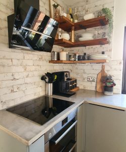 AFTER - Handmade concrete top and the old work tops used as shelves